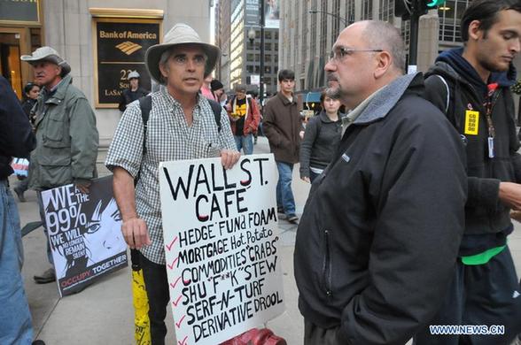 Protestors take part in the 'Occupy Chicago' demonstration in Chicago's financial district on Oct. 3, 2011. The protest on Wall Street in New York against corporate greed spread out to Chicago, as the 'Occupy Chicago' demonstration entered its tenth day on Monday. [Zhang Baoping/Xinhua] 