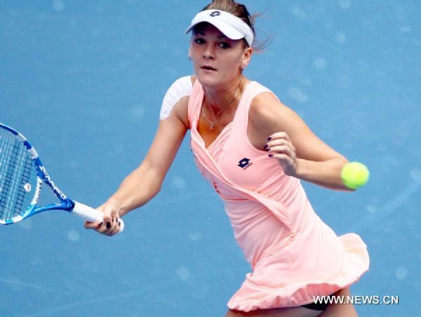 Poland's Agnieszka Radwanska competes during the women's singles quarterfinal against Serbia's Ana Ivanovic at 2011 China Open Tennis Tournament in Beijing, capital of China, on Oct. 7, 2011. Radwanska advanced to the semifinal after Ivanovic called off the match. [Chen Jianli/Xinhua]