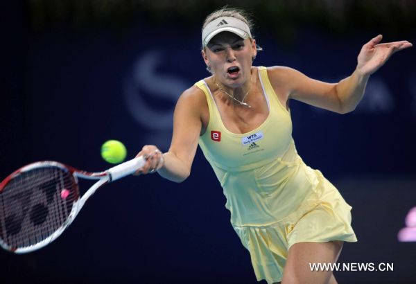 Denmark's Caroline Wozniacki returns a shot during the women's singles quarterfinal against Italy's Flavia Pennetta at 2011 China Open Tennis Tournament in Beijing, capital of China, on Oct. 7, 2011. Wozniacki lost the match 1-2. [Gong Lei/Xinhua]