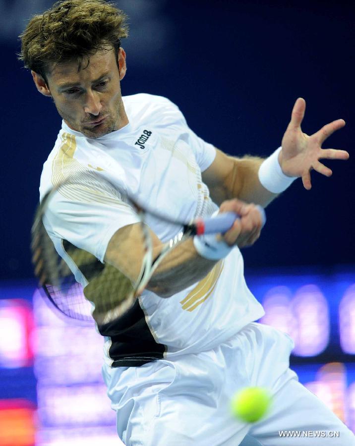 Spain's Juan Carlos Ferrero returns a shot during the men's singles quarterfinal against France's Jo-Wilfried Tsonga at 2011 China Open Tennis Tournament in Beijing, capital of China, on Oct. 7, 2011. Juan Carlos Ferrero lost the match 0-2. [Gong Lei/Xinhua]