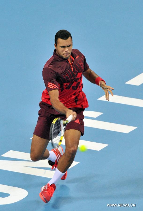 France's Jo-Wilfried Tsonga returns a shot during the men's singles quarterfinal against Spain's Juan Carlos Ferrero at 2011 China Open Tennis Tournament in Beijing, capital of China, on Oct. 7, 2011. Jo-Wilfried Tsonga won 2-0. [Li Wen/Xinhua]