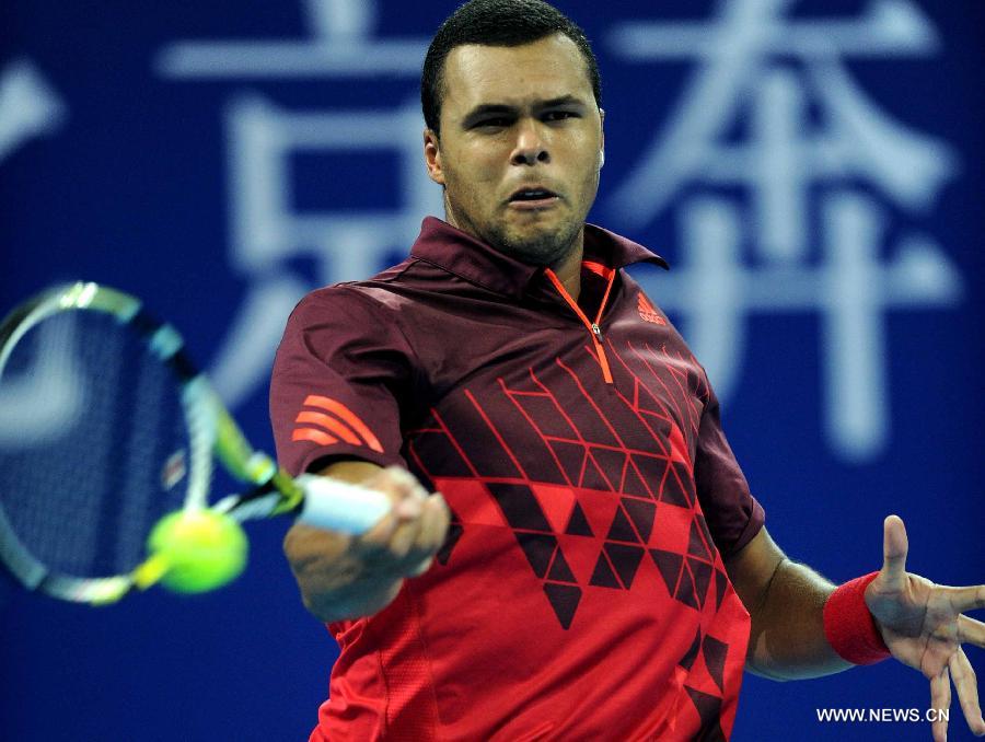 France's Jo-Wilfried Tsonga returns a shot during the men's singles quarterfinal against Spain's Juan Carlos Ferrero at 2011 China Open Tennis Tournament in Beijing, capital of China, on Oct. 7, 2011. Jo-Wilfried Tsonga won 2-0. [Gong Lei/Xinhua]