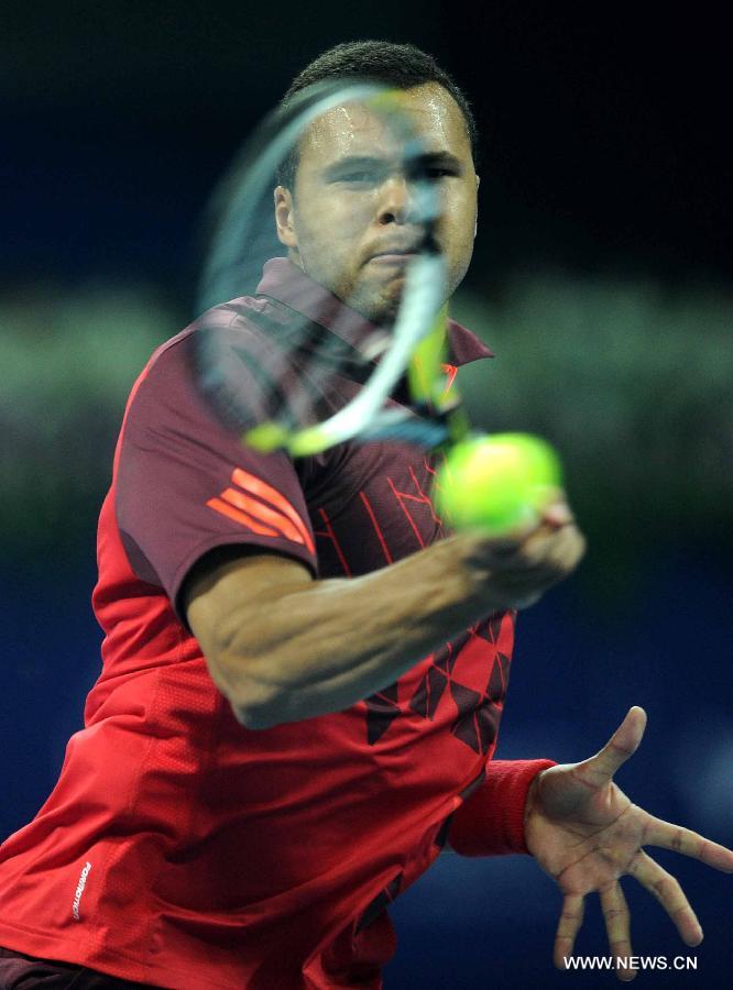 France's Jo-Wilfried Tsonga returns a shot during the men's singles quarterfinal against Spain's Juan Carlos Ferrero at 2011 China Open Tennis Tournament in Beijing, capital of China, on Oct. 7, 2011. Jo-Wilfried Tsonga won 2-0. [Gong Lei/Xinhua]