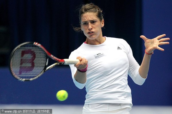 Andrea Petkovic of Germany returns a shot to Monica Niculescu of Romania during the semifinals of the China Open at the National Tennis Center on October 8, 2011 in Beijing, China.
