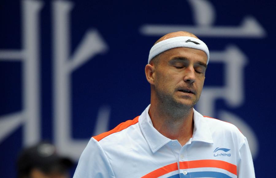 Croatia's Ivan Ljubicic reacts during the men's singles semifinal against his compatriot Martin Cilic at the 2011 China Open Tennis Tournament in Beijing, capital of China, on Oct. 8, 2011. Ljubicic failed to enter the final after losing the match 0-2. [Gong Lei/Xinhua]