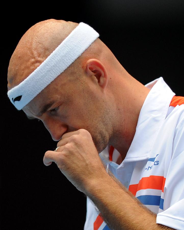 Croatia's Ivan Ljubicic reacts during the men's singles semifinal against his compatriot Martin Cilic at the 2011 China Open Tennis Tournament in Beijing, capital of China, on Oct. 8, 2011. Ljubicic failed to enter the final after losing the match 0-2. [Gong Lei/Xinhua]