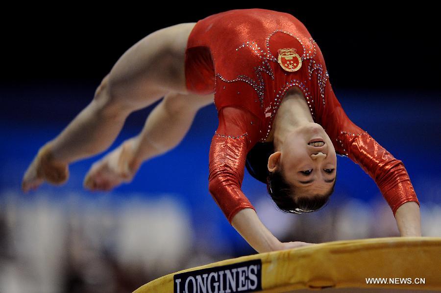 China's Jiang Yuyuan competes on the vault during the women's team qualifying round of the World Gymnastics Championships in Tokyo, capital of Japan, on Oct. 8, 2011. [Chen Xiaowei/Xinhua]