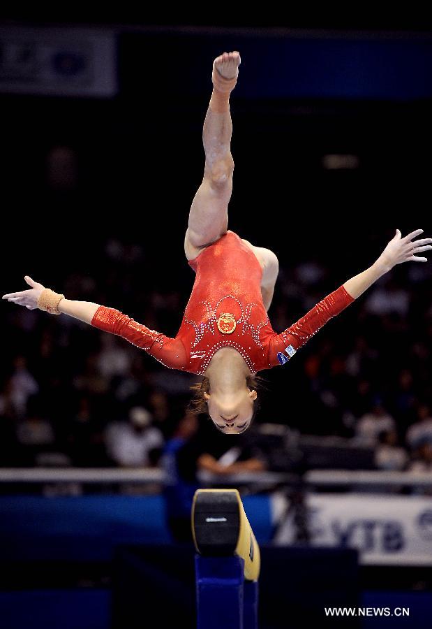 China's Yao Jinnan competes on the balance beam during the women's team qualifying round of the World Gymnastics Championships in Tokyo, capital of Japan, on Oct. 8, 2011. [Chen Xiaowei/Xinhua]