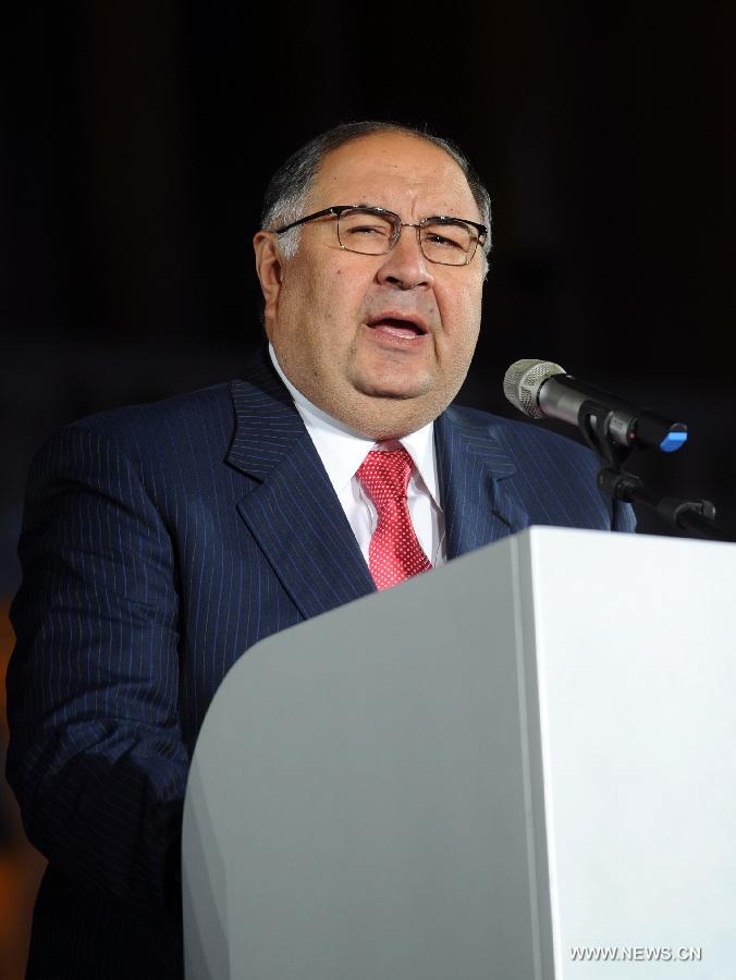 Alisher Usmanov, president of the International Fencing Federation, addresses the opening ceremony for the 2011 World Fencing Championships in Catania, Italy, on Oct. 8, 2011. The event will last from Oct. 9 to 16. [Wang Qingqin/Xinhua]