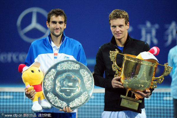 Czech Tomas Berdych, right, and Croatian Marin Cilic pose with their trophies after their singles final in the China Open Tennis Tournament at the national stadium in Beijing, Sunday, Oct. 9, 2011. Berdych won the final.