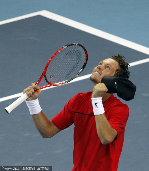 Czech Tomas Berdych reacts after he won the singles final against Croatian Marin Cilic in the China Open Tennis Tournament at the national stadium in Beijing, Sunday, Oct. 9, 2011. Berdych battled back to defeat Marin Cilic 3-6, 6-4, 6-1.