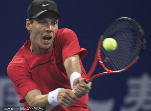 Czech Tomas Berdych returns a back hand shot to Croatian Marin Cilic during their singles final of the China Open Tennis Tournament at the national stadium in Beijing, Sunday, Oct. 9, 2011.