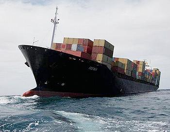 The cargo vessel Rena aground on Astrolabe Reef [Bay of Plenty Regional Council, New Zealand]