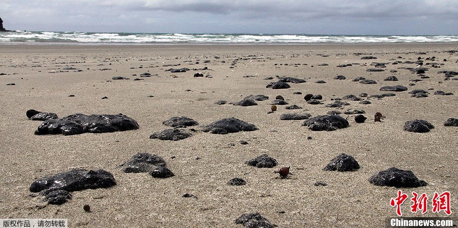 A dark spill, in parts thick and murky, was approaching Mayor Island last night as a large team of wildlife experts swung into action. The oil spilled from a Liberian- flagged cargo ship stranded on a reef off New Zealand shore has become &apos;worst ever&apos; maritime environmental disaster in the country.