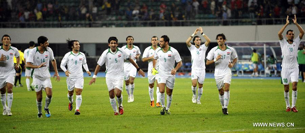 Players of Iraq celebrate victory after the 2014 World Cup Asian football qualification match against China in Shenzhen, south China's Guangdong Province, on Oct. 11, 2011. Iraq won 1-0