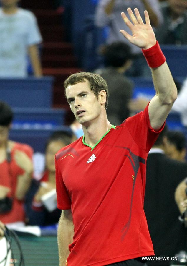 Andy Murray of Britain waves to the audience after the third round match against Stanislas Wawrinka of Switzerland at the 2011 Shanghai Rolex Masters tournament at the Qizhong Tennis Center in Shanghai, east China on Oct. 13, 2011. Murray won 2-1. [Fan Jun/Xinhua]