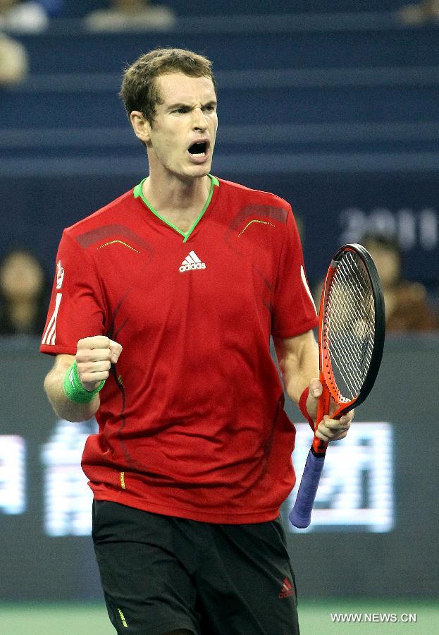 Andy Murray of Britain celebrates for a score during the match against Stanislas Wawrinka of Switzerland at the 2011 Shanghai Rolex Masters tournament at the Qizhong Tennis Center in Shanghai, east China on Oct. 13, 2011. Murray won 2-1. [Fan Jun/Xinhua]