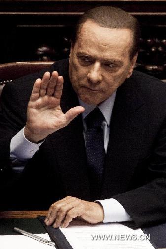 Italian Prime Minister Silvio Berlusconi attends the confidence vote at the lower house of the parliament in Rome, Italy, Oct. 14, 2011. [Stringer/Xinhua]