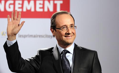 Francois Hollande, winner of the Socialist Party (PS) 2011 primary vote for France's 2012 presidential, waves as he arrives to a press conference at the party headquarters on October 16, 2011 in Paris.[Xinhua] 