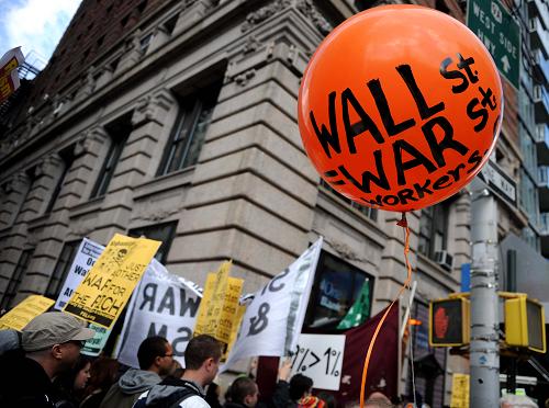 The Occupy Wall Street protester participate in a demonstration in New York to protest against the high umemployment rate and the wide gap between the rich and the poor. [Xinhua]