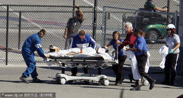 Dan Wheldon is transported to a medical helicopter following a crash early in the IndyCar Series' Las Vegas Indy 300 Auto Race at Las Vegas motor speedway in on Sunday, Oct. 16, 2011.