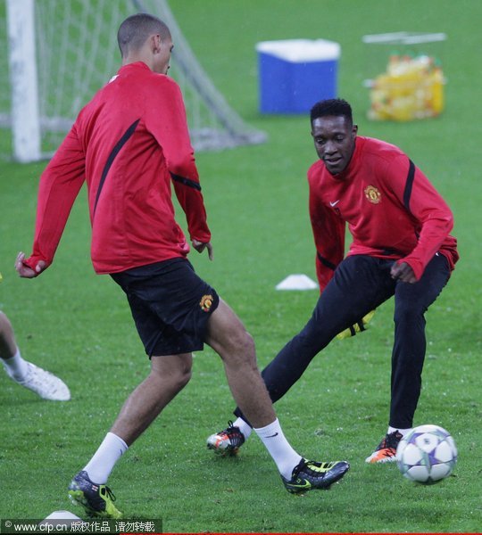 Chris Smalling (L) and Danny Welbeck of Manchester United in action during a first team training session, ahead of their UEFA Champions League Group C match against Otelul Galat0,i at Galati Stadium on October 17, 2011 in Galati, Romania. 