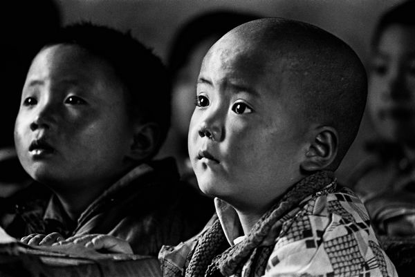 Students are very concentrated in their class. As many as one million students drop out of school every year in China due to poverty. [Xie Hailong / 'Zoom-in on Poverty' Global Photo Contest]