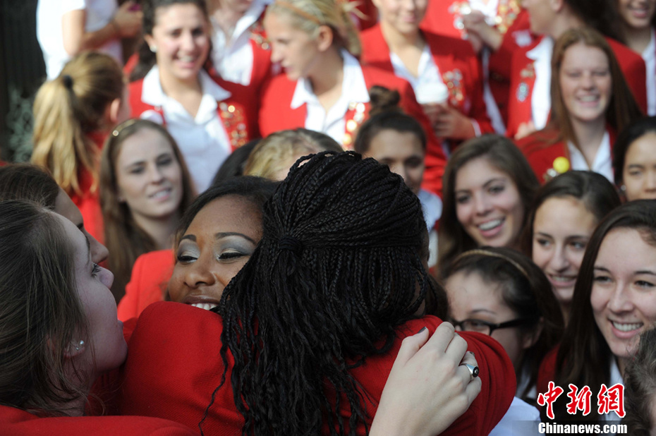 16 year old Drew Washington (left) gets a warm welcome from her schoolmates after being announced Tuesday morning as the 2012 Rose Queen in Pasadena. 