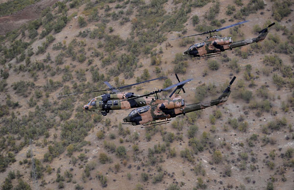 Turkish military helicopters fly over the Hakkari province during President Abdullah Gul's visit to southeastern Turkey on the Turkish-Iraqi border, Oct 15, 2011. [Agencies]