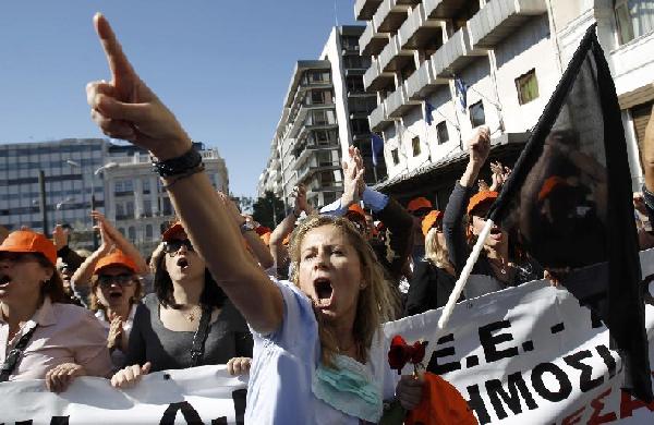 A woman shouts while taking part in an anti-austerity rally in Athens' Syntagma (Constitution) square October 19, 2011. [Xinhua]