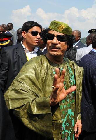 File photo taken on July 25, 2010 shows Muammar Gaddafi arrive to attend the 15th summit of the African Union (AU) Summit in Kampala, capital of Uganda. [Zhao Yingquan/Xinhua]