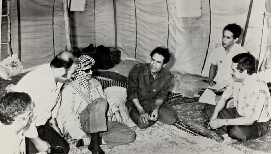 Former Libyan leader Muammar Gaddafi and former Palestinian leader Yasser Arafat 