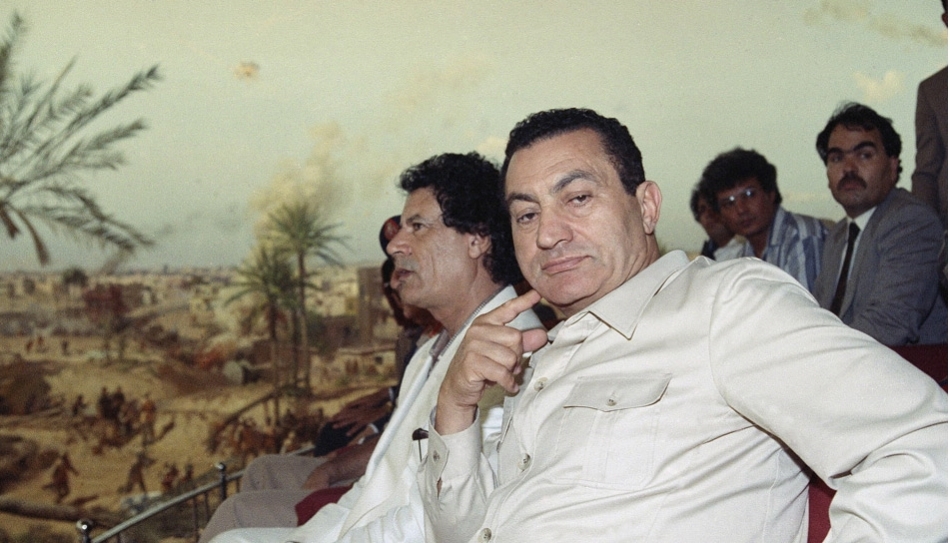 Former Libyan leader Muammar Gaddafi and former Egyptian leader Hosni Mubarak 