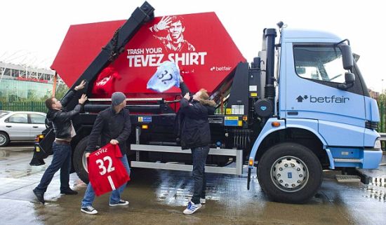  Fans discard their Carlos Tevez shirts in a skip outside Old Trafford.