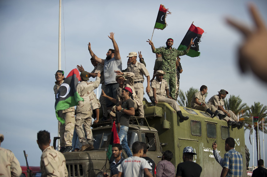 People in Tripoli, capital of Libya, celebrate the news that former leader Col. Muammar Gaddafi has been killed in Sirte. [Xinhua]