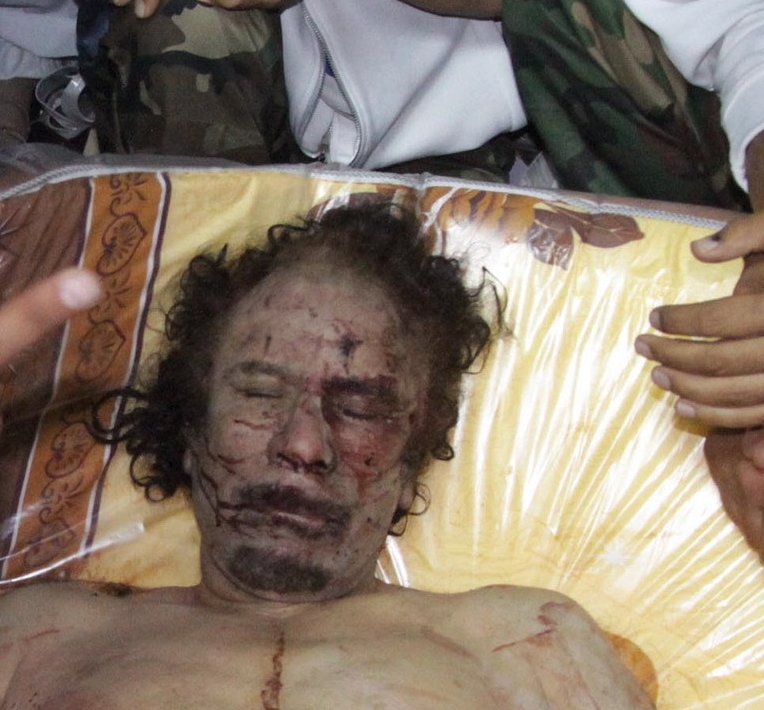 Libya's ousted leader Muammar Gaddafi was killed in gun battles On Oct.20, in his hometown, Sirte. Acting Prime Minister of the National Transitional Council (NTC), Mahmoud Jibril, confirmed his death at a press conference held in Tripoli.[Photo/Sina.com.cn]