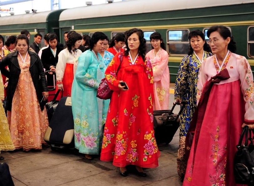 Artists arrived at the Dandong Railway Station in Dandong, northeast China's Liaoning Province, Oct. 21, 2011. About 180 artists of the Phibada Opera Troupe from the Democratic People's Republic of Korea (DPRK) arrived in China Friday. The troupe will stage opera 'The Butterfly Lovers' in various cities of China in the next 3 months.