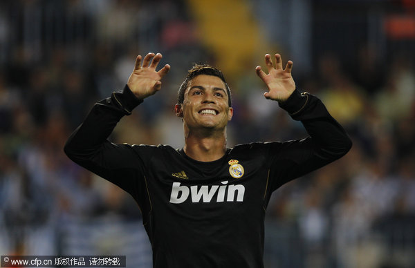 Ronaldo fires Real top, Barca held by Sevilla, Football