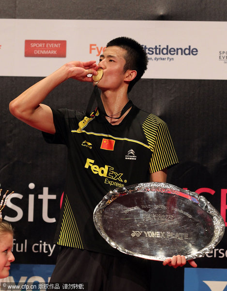 Chen Long of China kisses the medal after winning the Denmark Open on  Sunday, October 23, 2011.