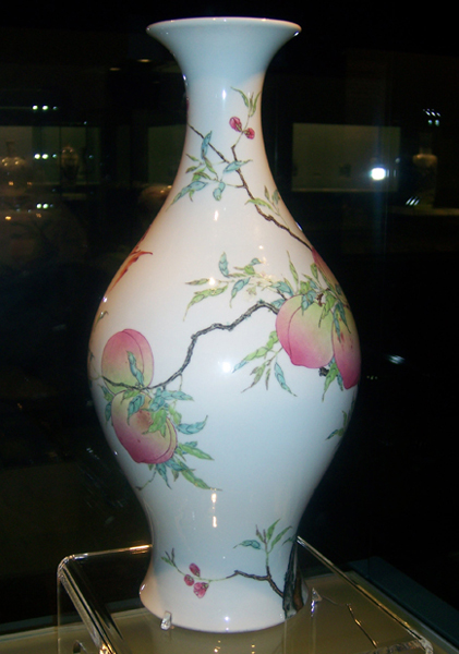 Yongzheng Fencai Bat Peach Stria Olive Vase, one of the 'Top 10 treasures inside Shanghai Museum' by China.org.cn.