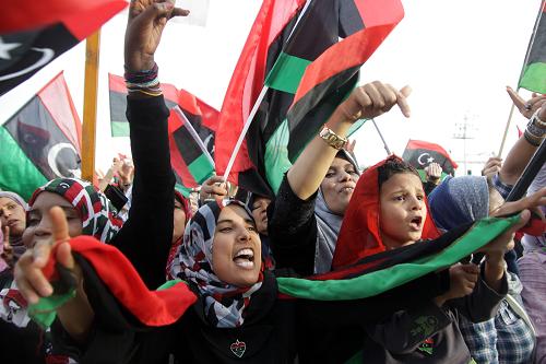 People celebrate the liberation of Libya at Martyrs' Square in Tripoli Oct. 23, 2011. Vice Chairman of the Libyan National Transitional Council (NTC) Abdel Hafiz Ghoga Sunday officially announced the liberation of Libya from the regime of Muammar Gaddafi at a ceremony being held in Libya's second largest city of Benghazi.