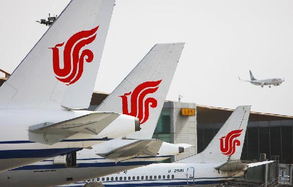 File photo taken on May 1, 2011 shows airplanes at the Beijing Capital International Airport in Beijing, capital of China.