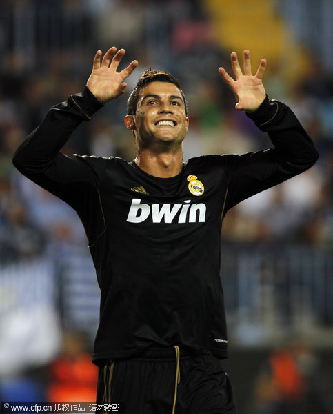 Real Madrid's Cristiano Ronaldo reacts after scoring a goal against Malaga during his Spanish La Liga soccer match at Rosaleda Stadium in Malaga, spain, on Saturday, Oct. 22, 2011.