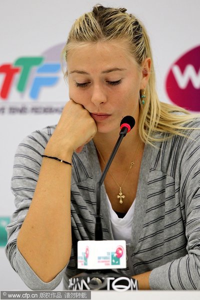 Maria Sharapova of Russia fields questions from the media after withdrawing from the tournament due to injury after her loss to Na Li of China during round robin play of the TEB BMP Paribas WTA Championships Istanbul at the Sinan Erdem Dome on October 26, 2011 in Istanbul, Turkey.