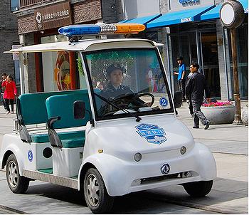 Electric Police car on Qianmen St., Beijing, April 26, 2011. [File photo] 