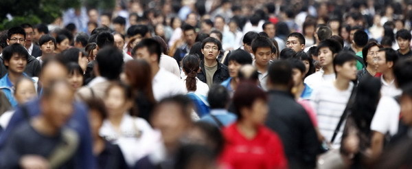 If the world seems more crowded, it may be because population will reach 7 billion on Monday, according to United Nation projections. The UN says this global milestone presents both an opportunity and a challenge for the planet. [Photo by Carlos Barria/China Daily via Reuters]