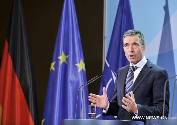 NATO Secretary-General Anders Fogh Rasmussen speaks during a press conference after meeting German Chancellor Angela Merkel in Berlin, Germany, on Oct. 27, 2011. NATO will wrap up its operations in Libya on Oct. 31, Rasmussen said here on Thursday.  (Xinhua/Ma Ning) (wf) 