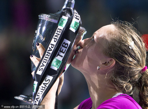 Czech Republic's Petra Kvitova kisses the trophy after winning the final of the WTA Championships against Victoria Azarenka of Belarus in Istanbul, Turkey on Sunday, Oct. 30, 2011.