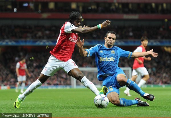 Gervinho of Arsenal takes on Jeremy Morel of Marseille during the UEFA Champions League Group F match between Arsenal FC v Olympique de Marseille at Emirates Stadium on November 1, 2011 in London, England 