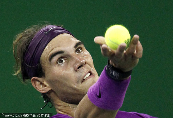 Rafael Nadal of Spain prepares for a service during his third round match against Florian Mayer of Germany at the Shanghai Masters tennis tournament in Shanghai, China on Thursday, Oct. 13, 2011. 